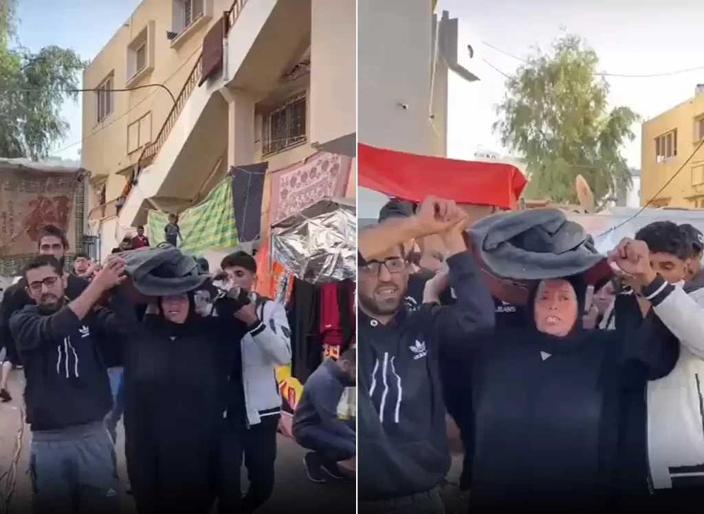 من غزة مصنع الرجال.. أم شهيد تحمله على رأسها: “مش خسارة بفلسطين” وطن