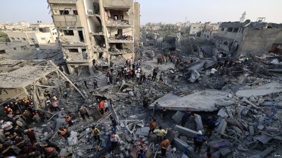 EDITORS NOTE: Graphic content / People check the damage caused by an Israeli strike on the Al-Maghazi refugee camp in Deir Balah in the central Gaza Strip, on November 5, 2023. - The Hamas-run health ministry said, Israeli bombing of Al-Maghazi refugee camp killed 45 people, with an eyewitness reporting children dead and homes smashed. (Photo by Mahmud HAMS / AFP)